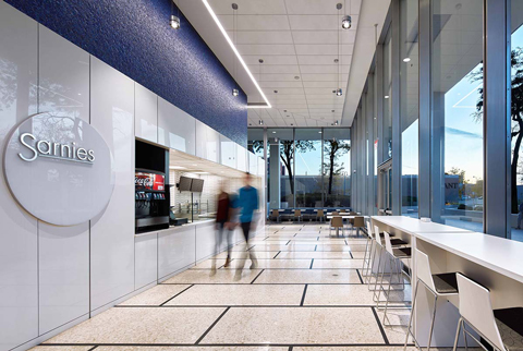 The Hylant Building’s café is accented with new signage and lighting, which is designed to increase visibility from outside the building